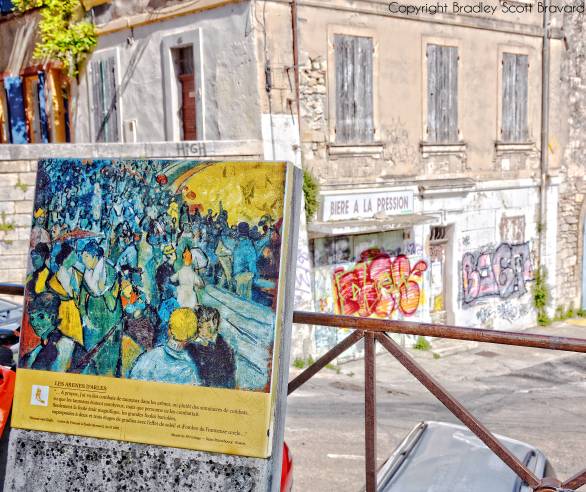 Van Gogh easel in Arles, France with graffiti in background